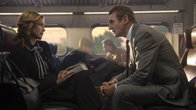 Vera Farmiga and Liam Neeson in a scene from <i>The Commuter</i>.