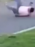 The shirtless man is sent rolling onto the ground after the impact.