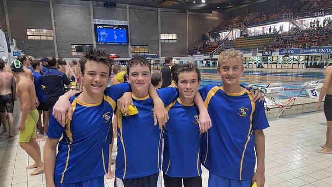 Marist College Ashgrove swimmers support on pool deck.