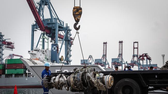 Indonesian rescue personnel recover the wreckage of an engine from the Lion Air flight JT 610 at Tanjung port in Jakarta. Picture: Getty Images