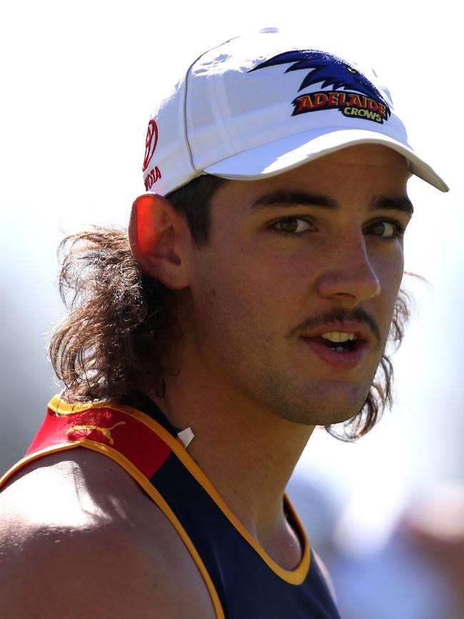 Taylor Walker, with his famous mullet, during a Crows pre-season training session in 2012. Picture: Regi Varghese/Getty