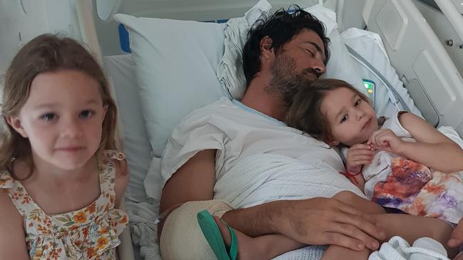 Rob Turner recovering in hospital with his kids by his side.