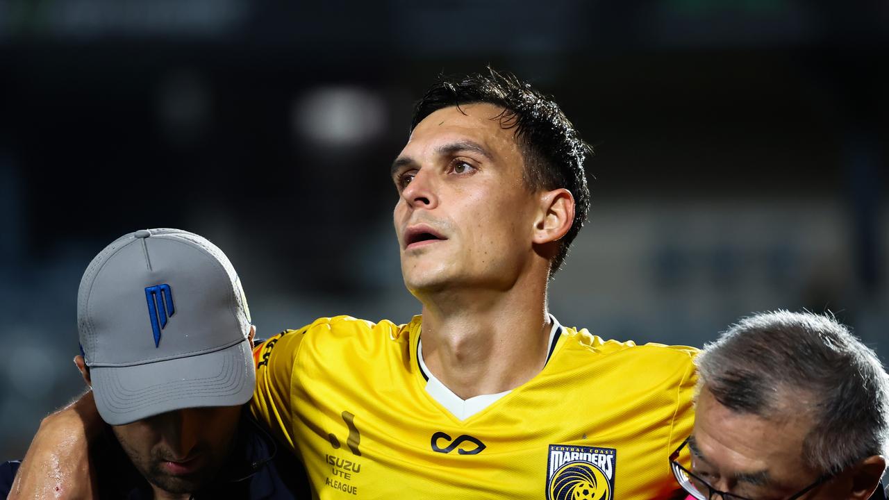 Trent Sainsbury of the Mariners is assisted off field after injury during the round 27 A-League Men match between Central Coast Mariners and Macarthur FC at Industree Group Stadium. Photo by Mark Evans/Getty Images.