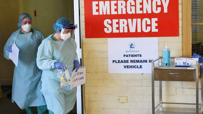 South Australia Hospital staff simulate a drive through coronavirus testing at the Repatriation Hospital. Picture: AAP Image/David Mariuz