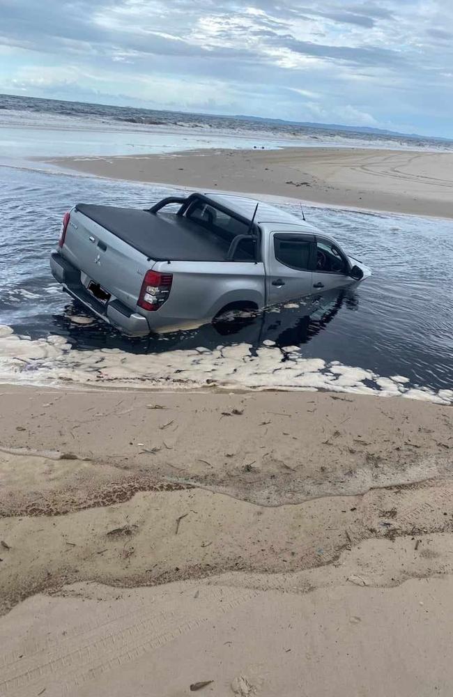 The 2019 Mitsubishi Triton Dual Cab utility became stuck in the water streaming out of Mermaid Lagoon, Bribie Island. Picture: Facebook