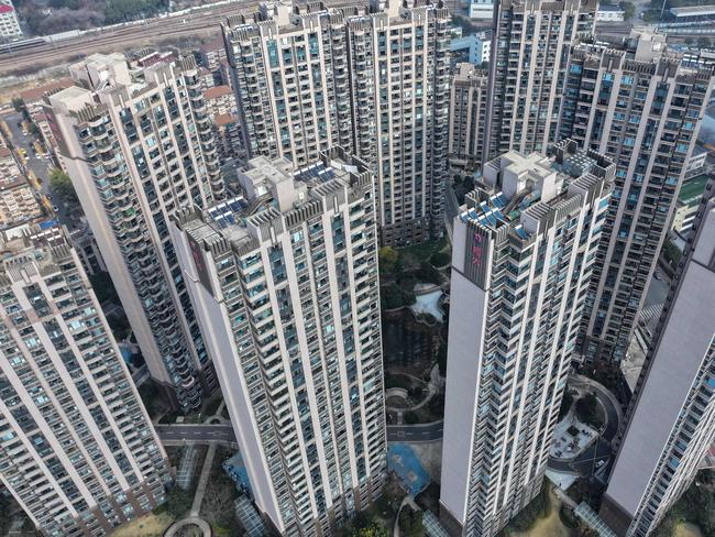 This aerial view shows a housing complex by Chinese property developer Evergrande in Nanjing, in China's eastern Jiangsu province on January 29, 2024. A Hong Kong court on January 29 ordered the liquidation of China's property giant Evergrande, but the firm said it would continue to operate in a case that has become a symbol of the nation's deepening economic woes. (Photo by AFP) / China OUT