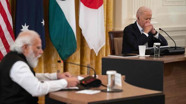 US President Joe Biden listens as India Prime Minister Narendra Modi speaks during the first-ever in-person Quad Leaders Summit. (Photo by Jim WATSON / AFP)