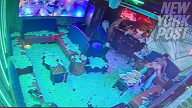 Bills cover the strip club floor