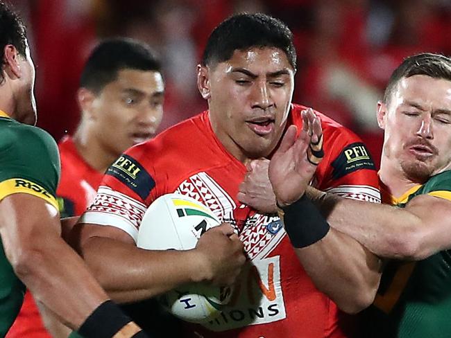 Jason Taumalolo of Tonga (C) is tackled by Australian players during the rugby league international Test match between Australia and Tonga at Mt Smart Stadium in Auckland on October 20, 2018. (Photo by Fiona Goodall / AFP)