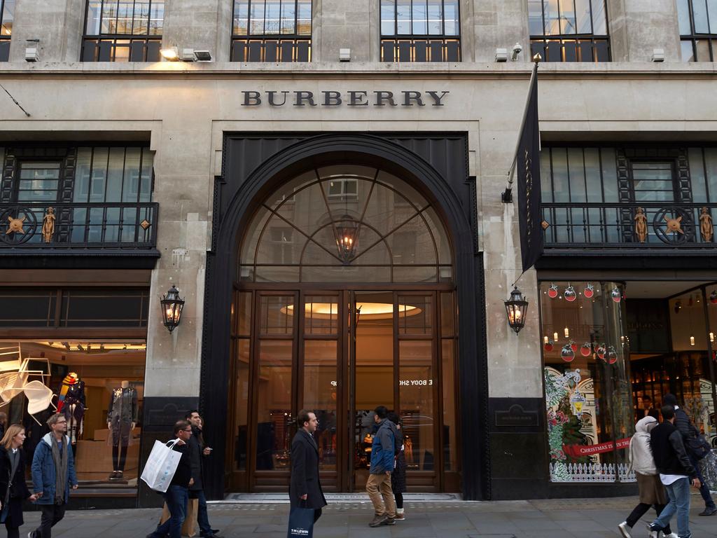 Pedestrians pass the Burberry store as they walk along Regent Street in central London. Picture: Niklas Hallen/AFP
