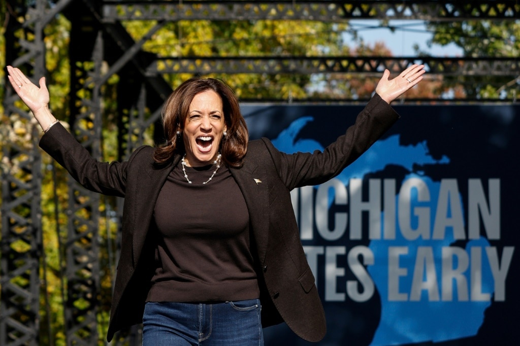 Kamala Harris arrives onstage for a campaign rally in Grand Rapids, Michigan