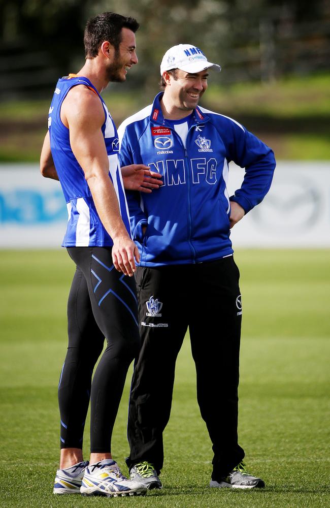 Robbie Tarrant and Kangaroos coach Brad Scott share a laugh at training. Picture: Colleen Petch