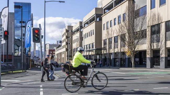 Cyclist on the intersection of Collins and Barrack Street - New bike lanes and parklets proposed. Picture: Caroline Tan