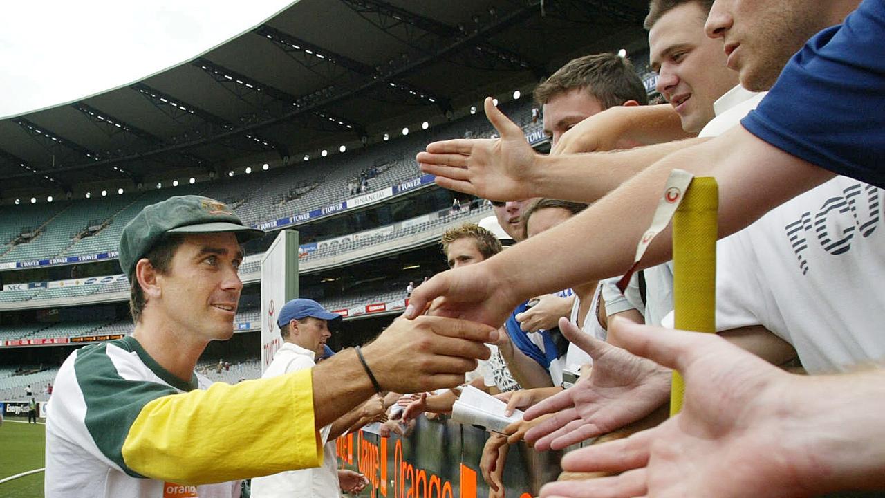 Justin Langer shakes hands with the Barmy Army in 2002. 
