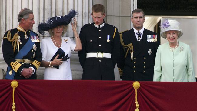 Prince Charles, Prince of Wales, Camilla, Duchess of Cornwall, son Prince Harry, brother Prince Andrew, Duke of York, and the Queen, watch a flypast over The Mall in 2005.