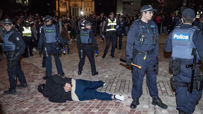 A young man is arrested. Picture: Jason Edwards