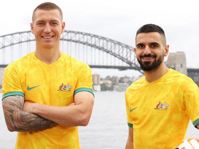 SYDNEY, AUSTRALIA - MARCH 21: Awer Mabil, Mitchell Duke and Aziz Behich pose during an Australian Socceroos media opportunity at Mrs Macquarie's Chair on March 21, 2023 in Sydney, Australia. (Photo by Mark Kolbe/Getty Images)