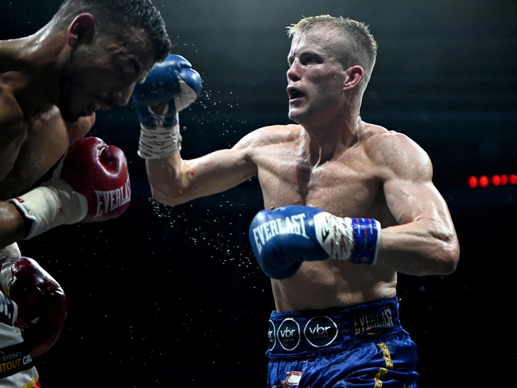 Liam Wilson lands a right on Youssef Dib in their heated bout in Brisbane. Picture: Scott Davis / Ace Boxing