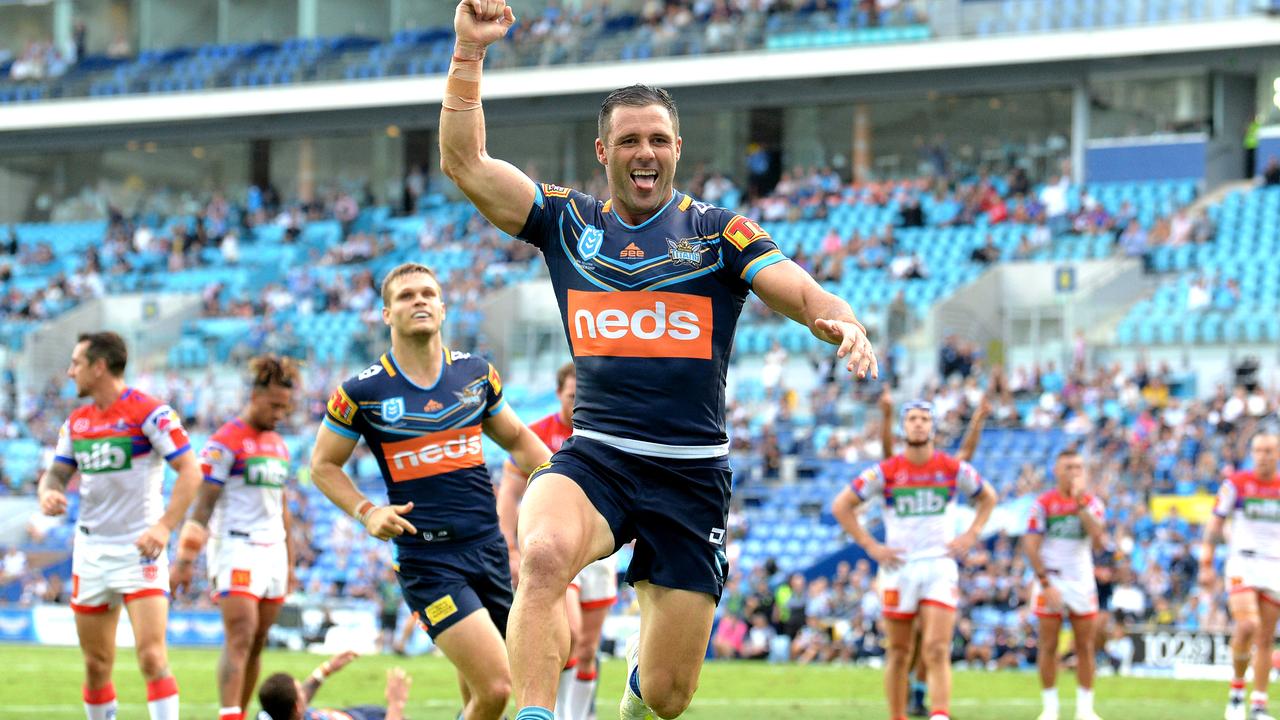 Michael Gordon of the Titans celebrates scoring a try during the round 6 NRL match against the Knights