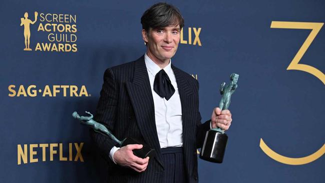 Irish actor Cillian Murphy poses in the press room with the awards for Outstanding Performance by a Male Actor in a Leading Role in a Motion Picture and Outstanding Performance by a Cast in a Motion Picture for "Oppenheimer" during the 30th Annual Screen Actors Guild awards at the Shrine Auditorium in Los Angeles, February 24, 2024. (Photo by Robyn BECK / AFP)