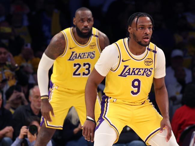 LOS ANGELES, CALIFORNIA - OCTOBER 22: LeBron James #23 and Bronny James #9 of the Los Angeles Lakers on defense during the second quarter against the Minnesota Timberwolves at Crypto.com Arena on October 22, 2024 in Los Angeles, California. (Photo by Harry How/Getty Images) *** BESTPIX ***