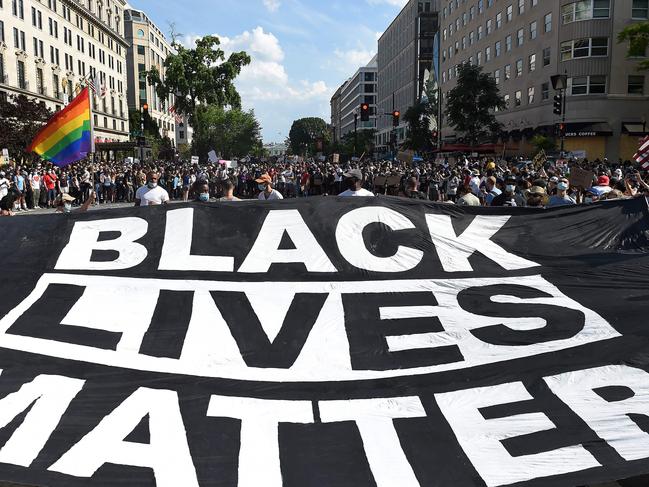 Demonstrators deploy a " Black Lives Matter" banner near the White House. Picture: AFP