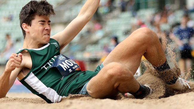 William Moir of Wagga Trinity Grammar School competing in the long jump.