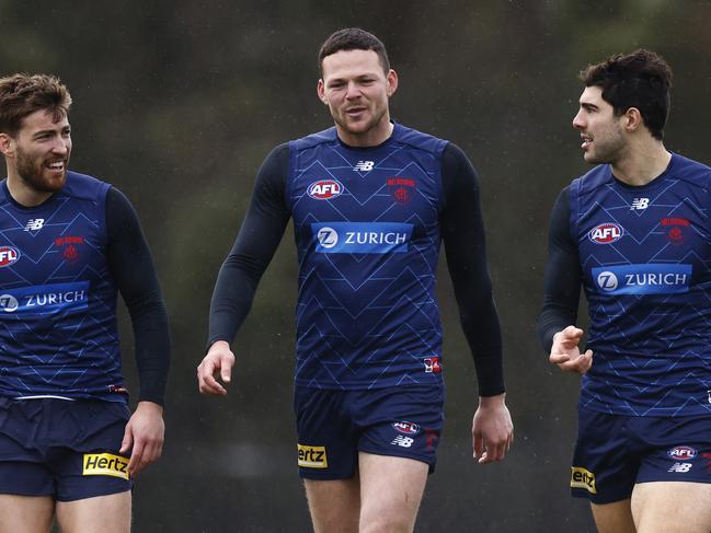 MELBOURNE, AUSTRALIA - JUNE 10: Steven May of the Demons (C) shares a laugh with Jack Viney (L) and Christian Petracca (2R) during a Melbourne Demons AFL training session at Casey Fields on June 10, 2022 in Melbourne, Australia. (Photo by Daniel Pockett/Getty Images)