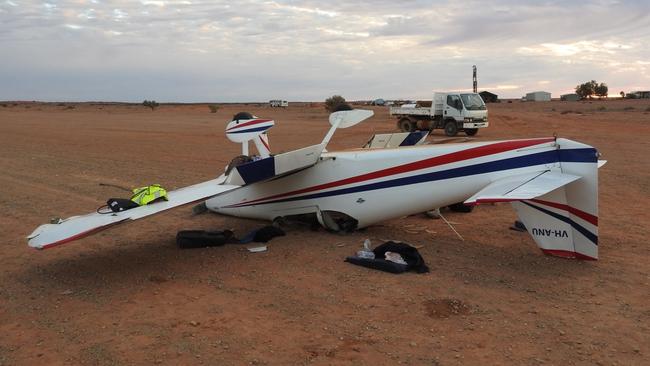 The crashed plane at William Creek after the pilot and his passenger were removed for treatment. Picture: South Australian Police.