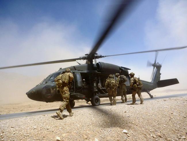 Australian Army soldiers from Special Operations Task Group board a US Army Black Hawk helicopter after a mission in Uruzgan province, southern Afghanistan, in 2012. Picture: ADF/Supplied