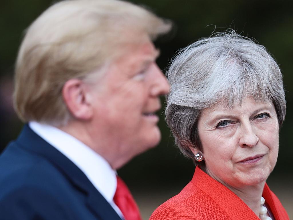 Britain's Prime Minister Theresa May (R) listens as US President Donald Trump (L) speaks during a joint press conference following their meeting at Chequers. Picture: Getty Images 