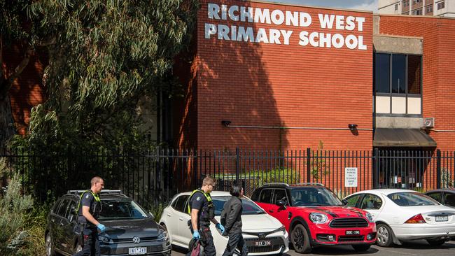 The state government has employed three officers to welcome parents and kids at the gates of Richmond West Primary School. Picture: Jason Edwards