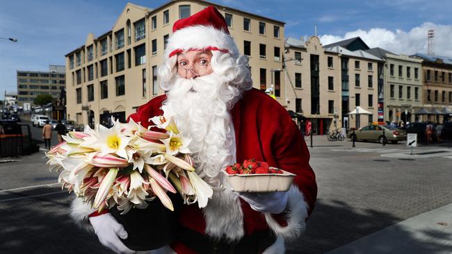 Santa with produce ready for the Christmas Eve edition of Salamanca Market. Picture: Nikki Davis-Jones