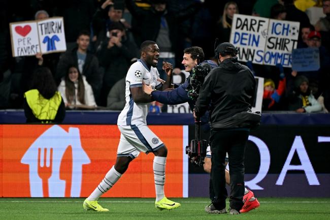 Marcus Thuram (L) celebrates netting his winner at Young Boys