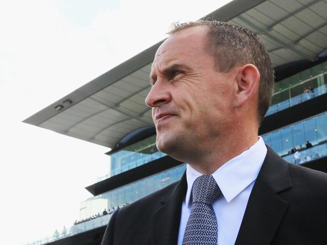 Business as usual: Trainer Chris Waller looks on after quinellaing race four. Picture: Getty Images