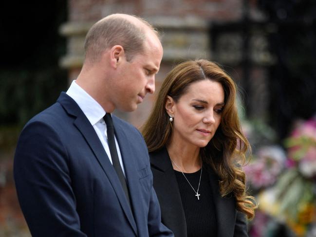 Prince William and Princess Catherine view floral tributes outside Norwich Gate. Picture: AFP