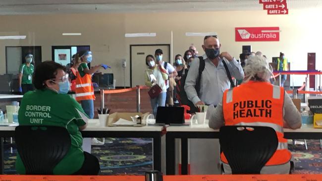 Travellers from South Australia arrive for processing at Alice Springs airport, November 18