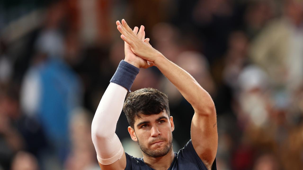 PARIS, FRANCE – MAY 29: Carlos Alcaraz of Spain celebrates his victory against Jesper De Jong of the Netherlands in the Men's Singles second round match during Day Four of the 2024 French Open at Roland Garros on May 29, 2024 in Paris, France. (Photo by Clive Brunskill/Getty Images)