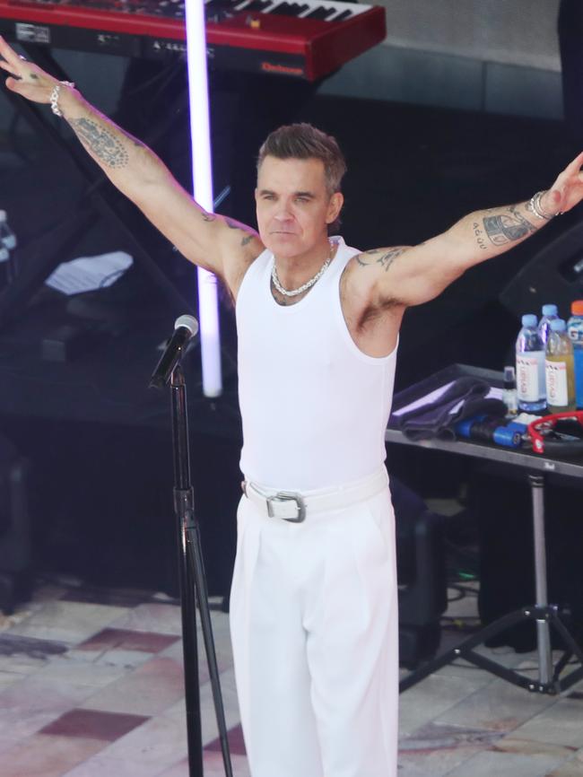 MELBOURNE, AUSTRALIA- NewsWire Photos JANUARY 2, 2025: Entertainer Robbie Williams who is holding a free mini concert at Federation Square Melbourne as part of his publicity tour for the movie Better Man. Picture: NewsWire/ David Crosling