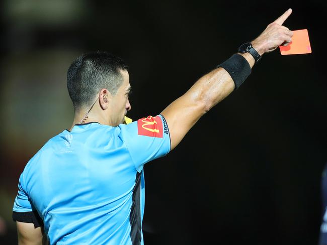 GOSFORD, AUSTRALIA - FEBRUARY 22: Referee Stephen Lucas shows Matt Simon a red card and sends him off during the Round 20 A-League Match between the Central Coast Mariners and Brisbane Roar FC at Central Coast Stadium on February 22, 2019 in Gosford, Australia. (Photo by Tony Feder/Getty Images)