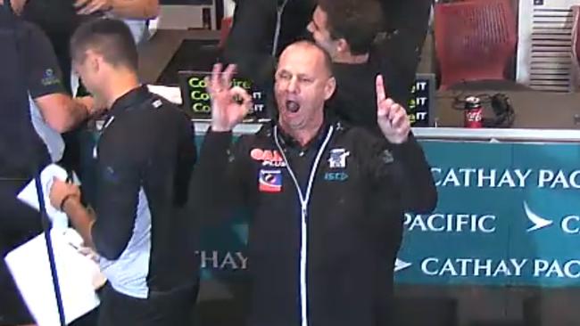 Screenshots of Port Adelaide coach Ken Hinkley celebrating Port Adelaide's win over Adelaide in Showdown 44. 