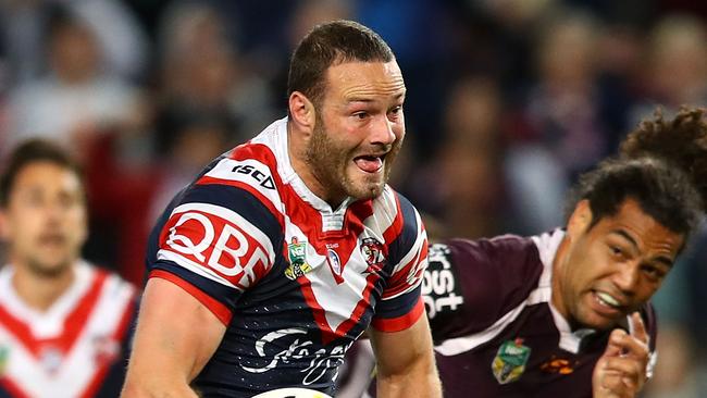 Boyd Cordner of the Roosters breaks away to score a try.