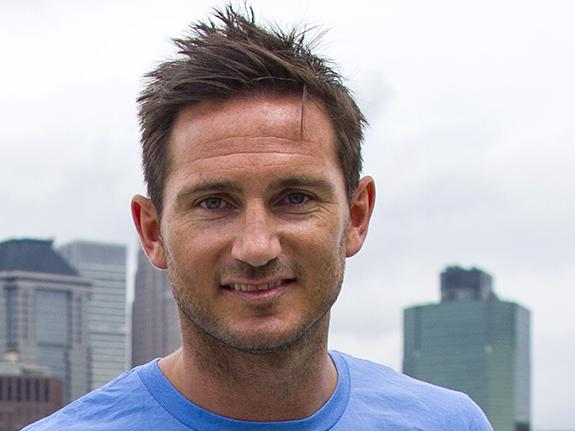 Frank Lampard, of England, poses with the Manhattan skyline behind him after his introduction as a member of the MLS expansion club New York City FC, Thursday, July 24, 2014, in New York. (AP Photo/Craig Ruttle)