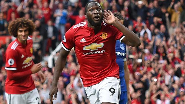 Manchester United's Belgian striker Romelu Lukaku (C) celebrates after scoring their third goal during the English Premier League football match between Manchester United and Everton.