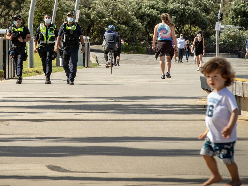 Public Service Officers patrol at St Kilda beach in Melbourne. Picture: Darrian Traynor/Getty Images