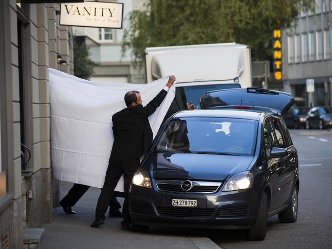 FIFA officials were escorted out behind sheets at the Baur au Lac hotel in Zurich.