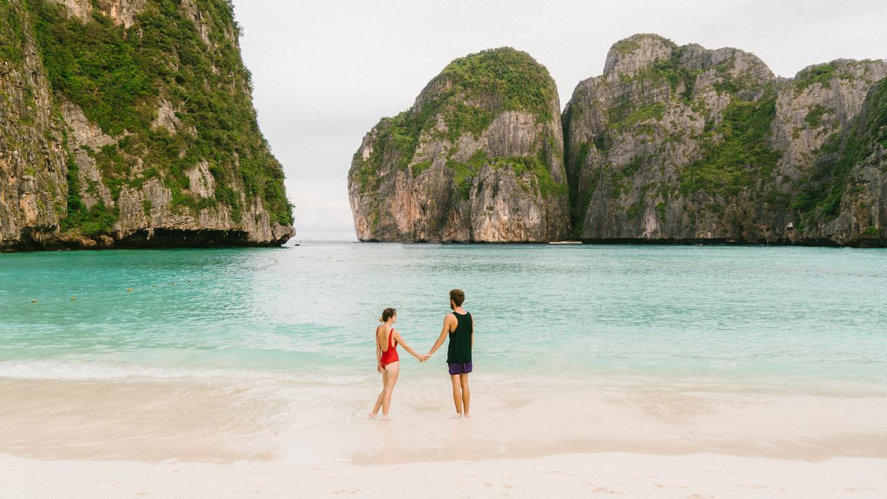 Couple on Maya Bay beach in Thailand