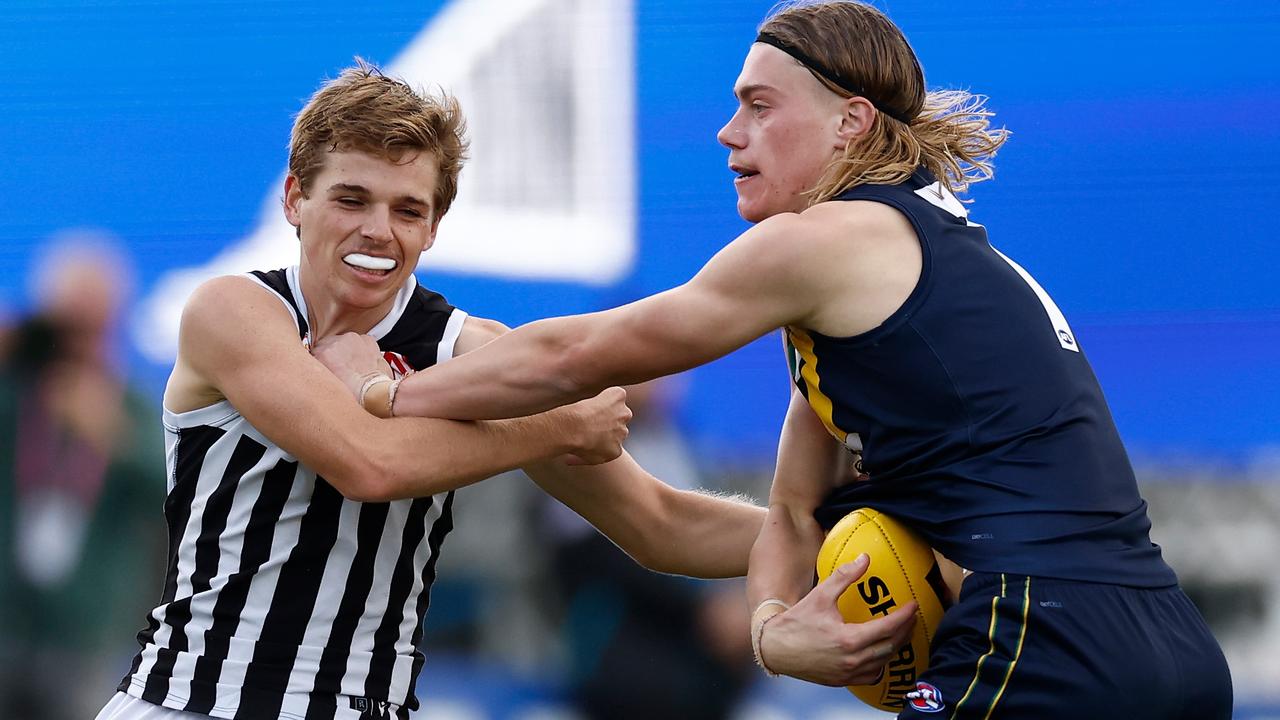 Harley Reid applies a trademark fend off during the match between the AFL Academy and Port Adelaide Magpies at Summit Sports Park on April 15. Picture: Michael Willson/AFL Photos via Getty Images