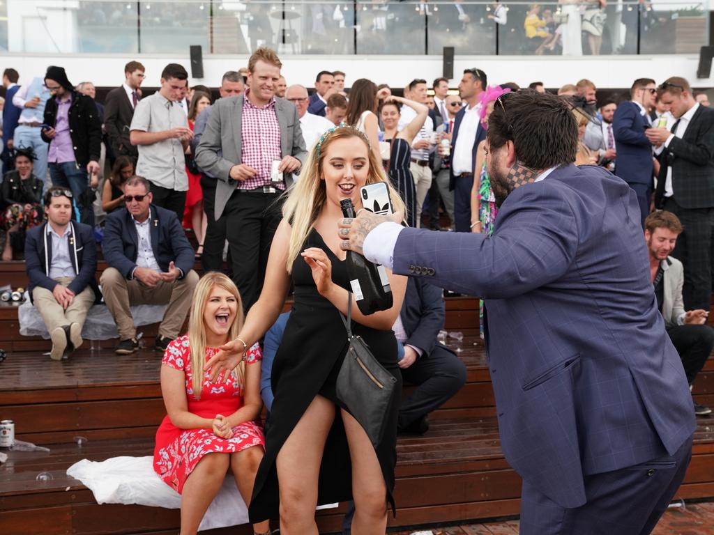 Racegoers are seen in the late afternoon on Melbourne Cup day during the Lexus Melbourne Cup Day, as part of the Melbourne Cup Carnival, at Flemington Racecourse in Melbourne, Tuesday, November 6, 2018. (AAP Image/Stefan Postles) NO ARCHIVING, EDITORIAL USE ONLY