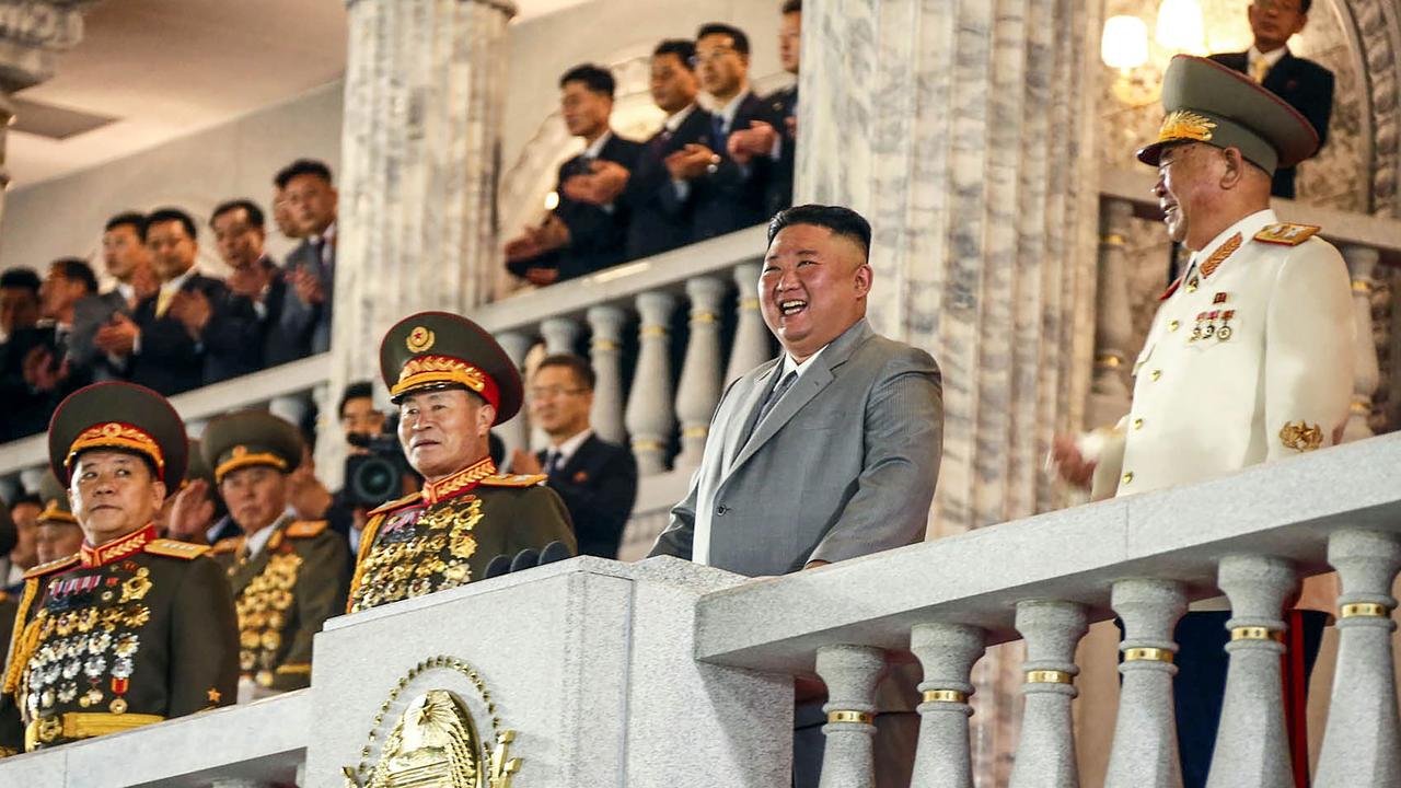 Kim Jong-un laughs with his generals. Picture: AFP